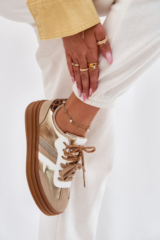 Zapatillas modelo zapatos. Femenino con una plataforma Z PodAójnym atándosem con estampados de piel de leopardo color dorado Nit