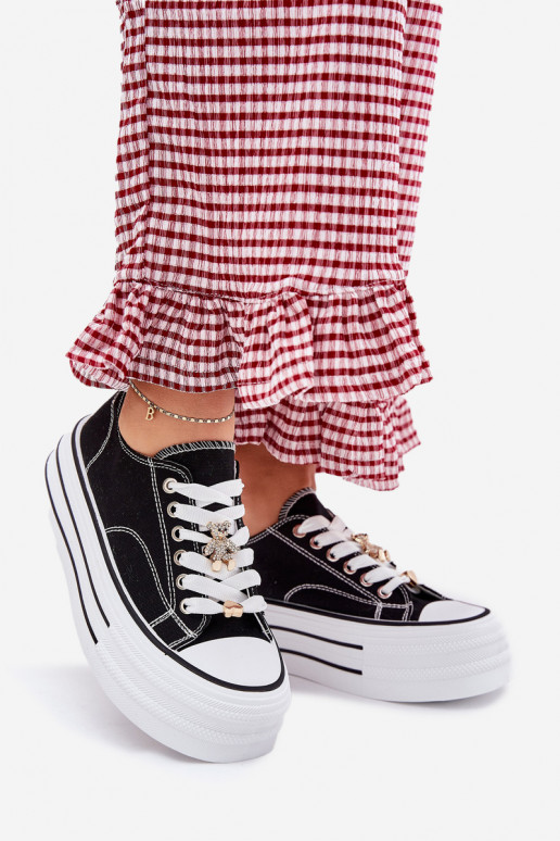 Zapatos de ocio con una plataforma Ze color doradomi Przypinkami de color negro Fiorina