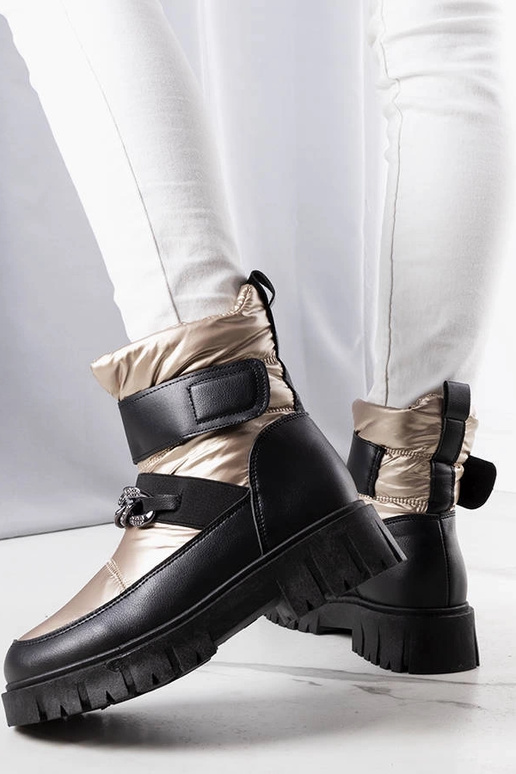 Botas de nieve con cadena dorada de...