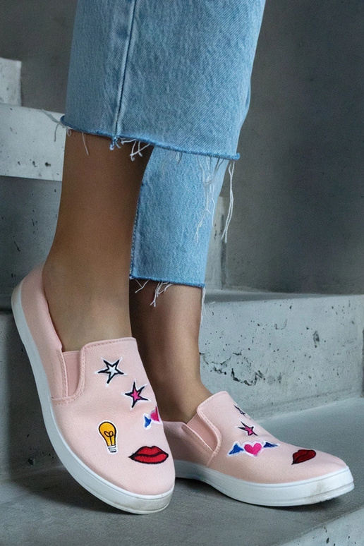 Zapatillas de tela rosa con parches...