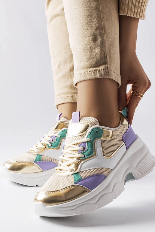 Zapatillas blancas y doradas para...