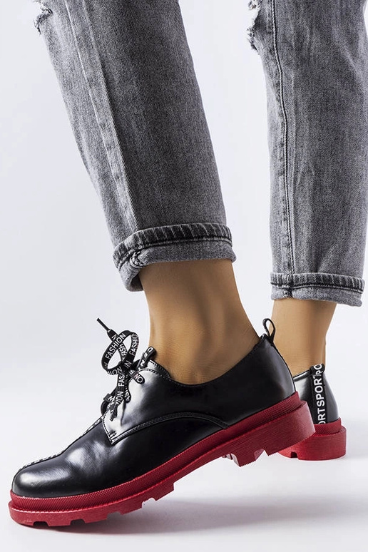 Botas negras de media caña con suela...