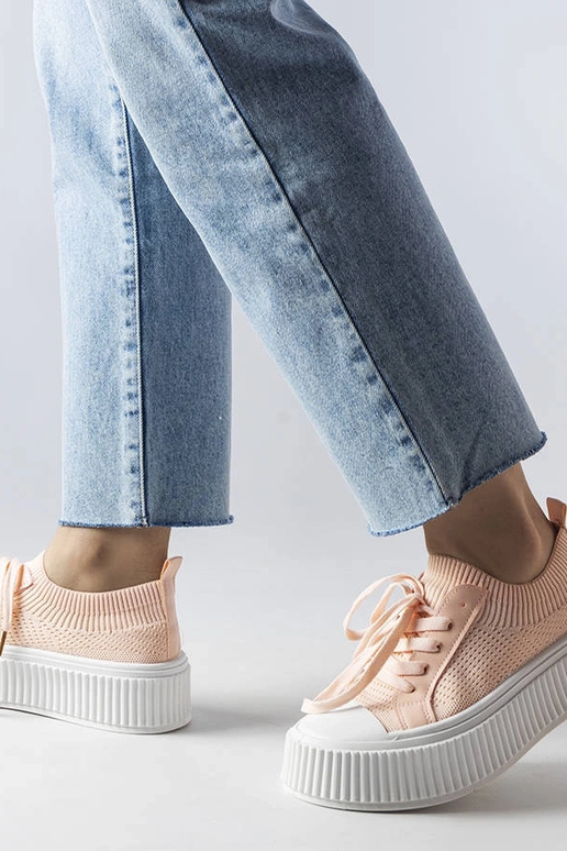 Zapatillas de tela rosa sobre... Zapatillas de tela rosa sobre...