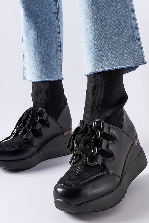 Botas negras con cuña tipo calcetín...