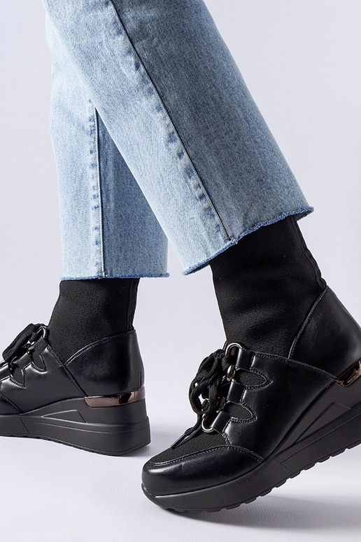 Botas negras con cuña tipo calcetín...