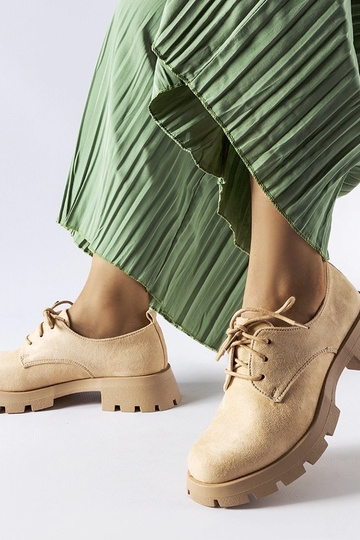 Botas de media caña beige... 2