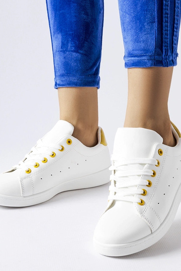 Zapatillas blancas con detalles amarillos Bushnell