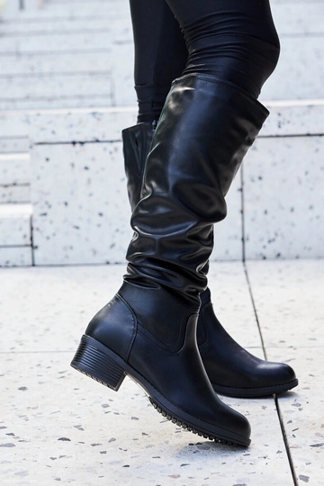 Botas Angelico negras con volantes