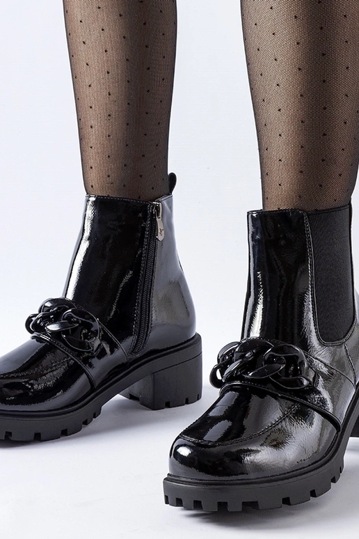 Botas negras de charol con hebilla y...