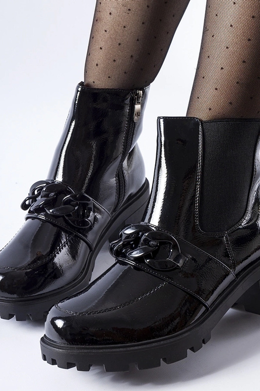 Botas negras de charol con hebilla y...