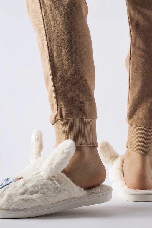 Zapatillas blancas con orejas y lazo...