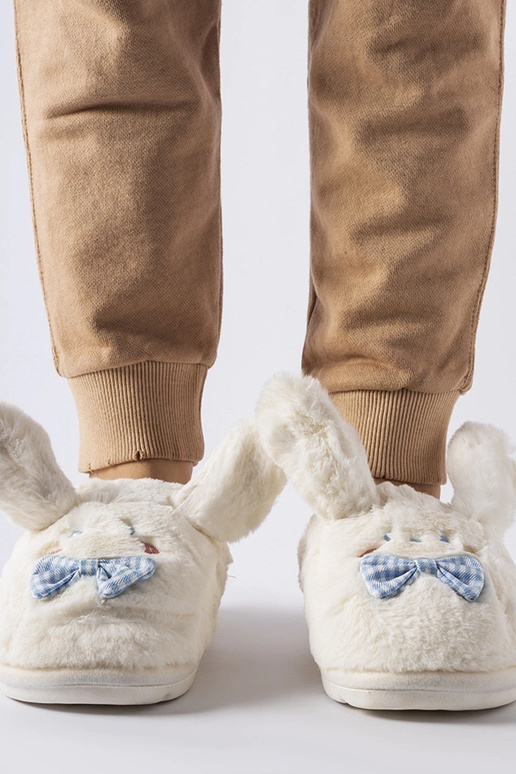 Zapatillas blancas con orejas y lazo...