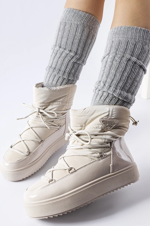 Botas de nieve beige lacadas con goma... Botas de nieve beige lacadas con goma...