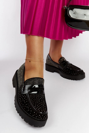 Mocasines negros decorados...