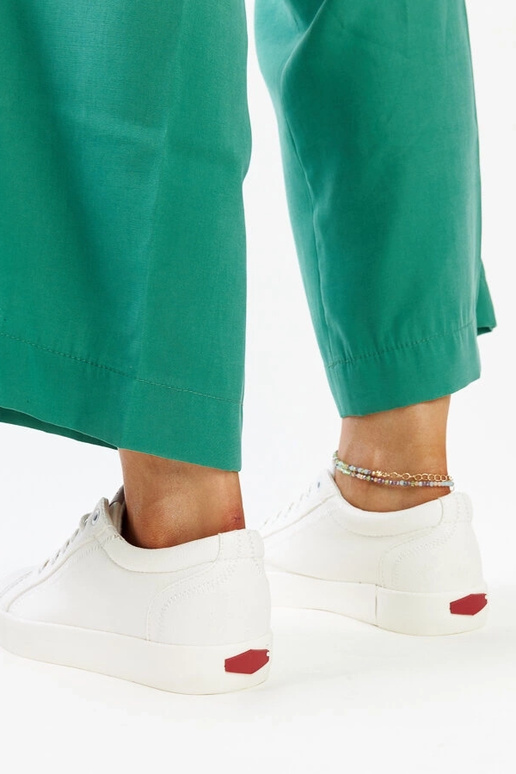 Zapatillas blancas de mujer en piel...