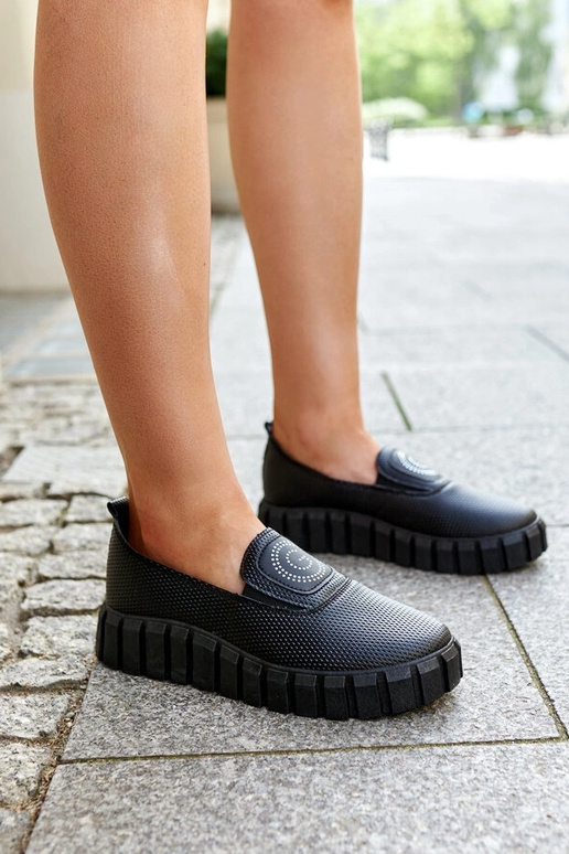 Botas negras de media caña con suela...