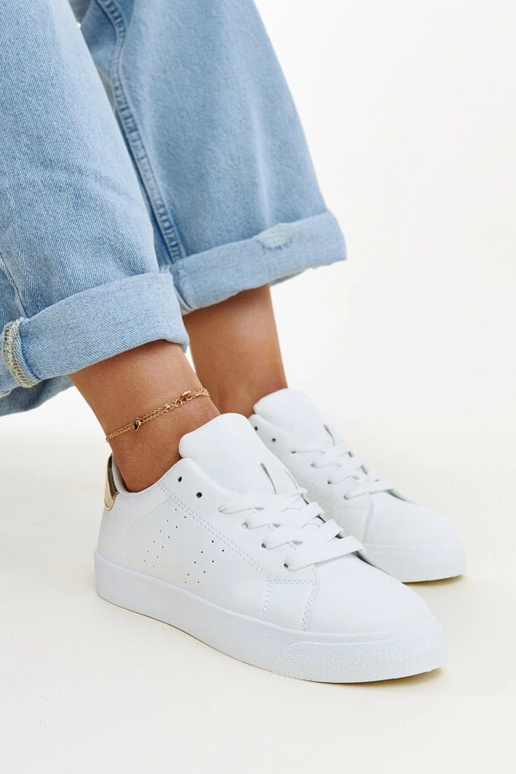 Zapatillas Akila blancas y doradas