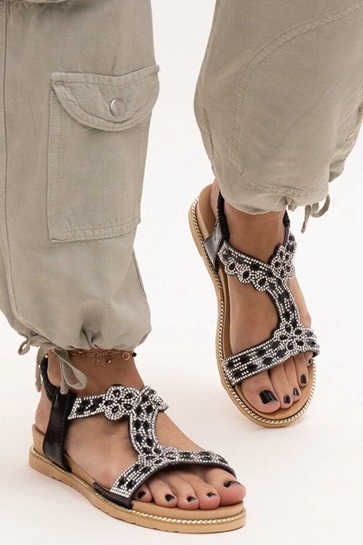 Las sandalias negras brillantes de...