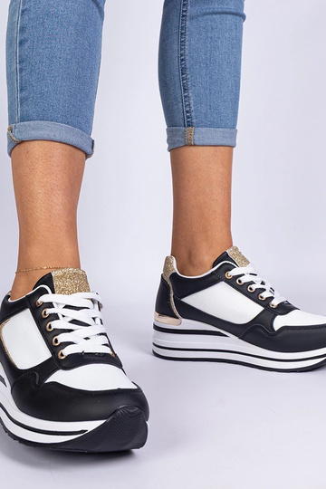 Zapatillas negras decoradas con purpurina y detalle metálico Olaria