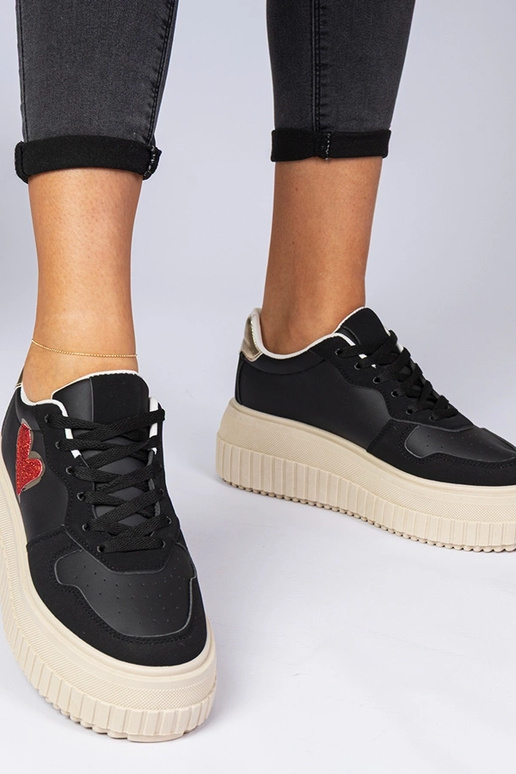 Zapatillas deportivas negras de mujer... Zapatillas deportivas negras de mujer...