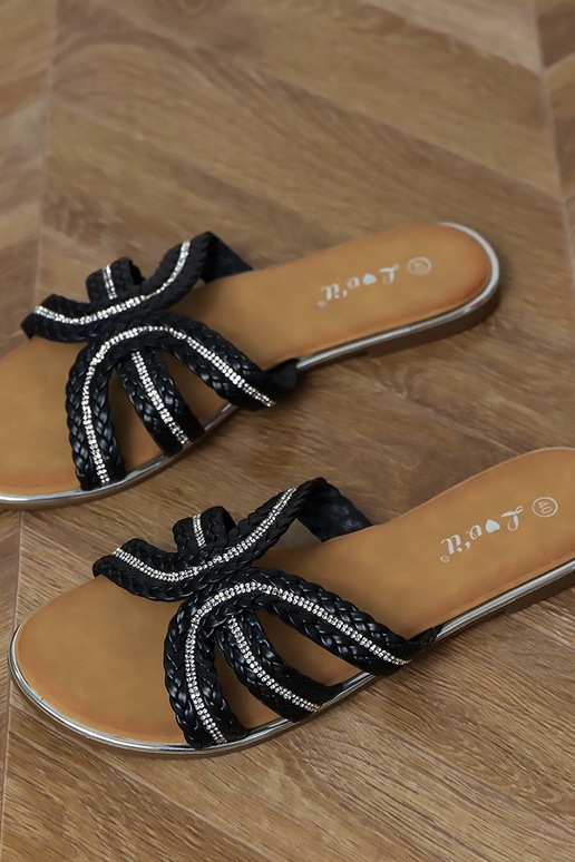 Pantuflas planas negras con elementos...