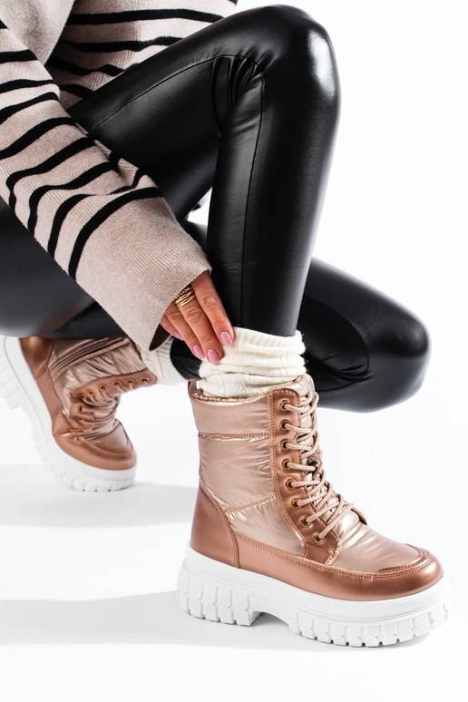 Botas de nieve de mujer color dorado... Botas de nieve de mujer color dorado...