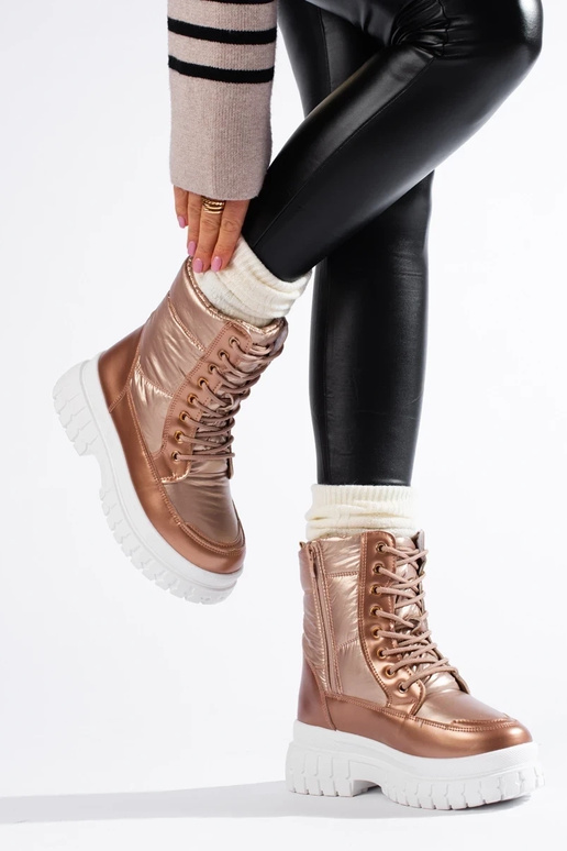 Botas de nieve de mujer color dorado... Botas de nieve de mujer color dorado...