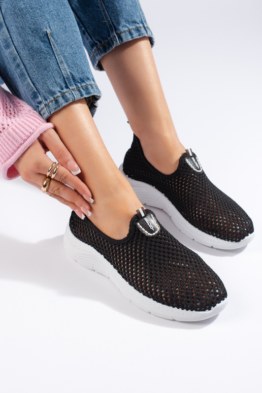 calzado deportivo negro con elementos...