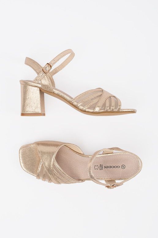 Sandalias brillantes doradas de tacón