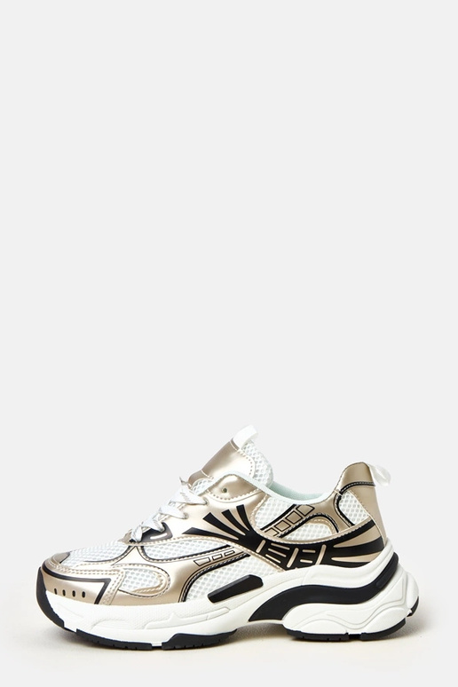 Zapatillas deportivas doradas sobre... Zapatillas deportivas doradas sobre...