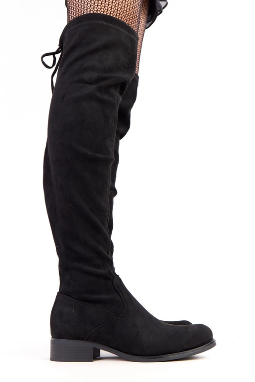 Botines largos negros de suela plana...