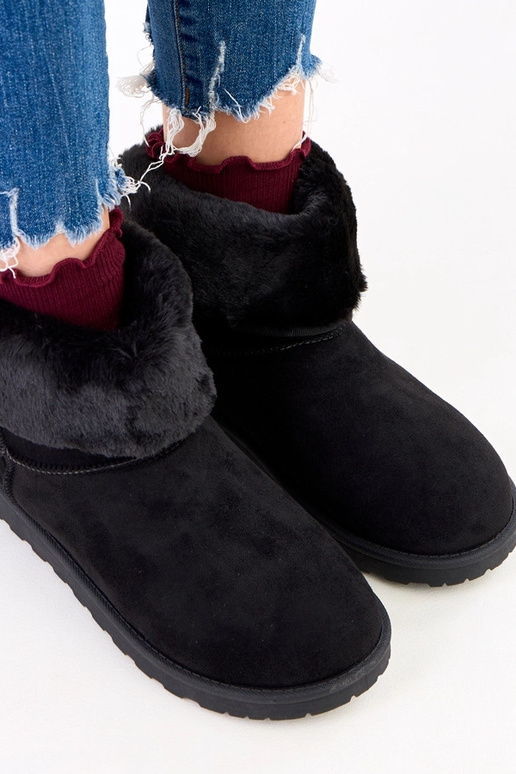 Botas de nieve negras con piel sobre...