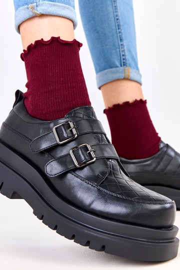 Botines negros sobre suela... 2