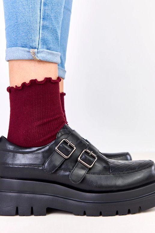 Botines negros sobre suela masiva,...