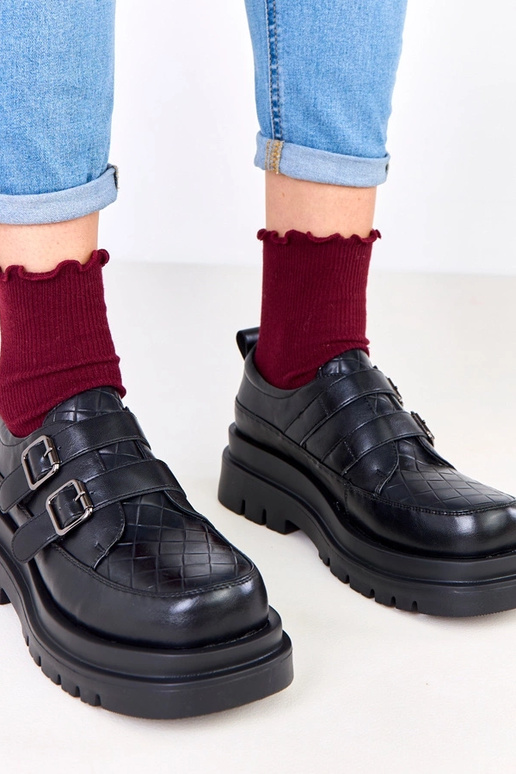 Botines negros sobre suela masiva,...