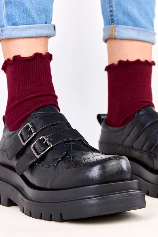 Botines negros sobre suela masiva,...