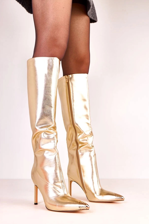 Botas largas elegantes doradas con... Botas largas elegantes doradas con...