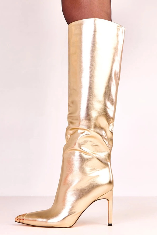 Botas largas elegantes doradas con... Botas largas elegantes doradas con...