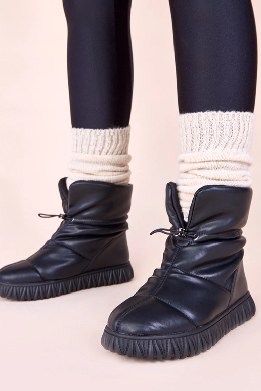 Botas negras de nieve de cuero...