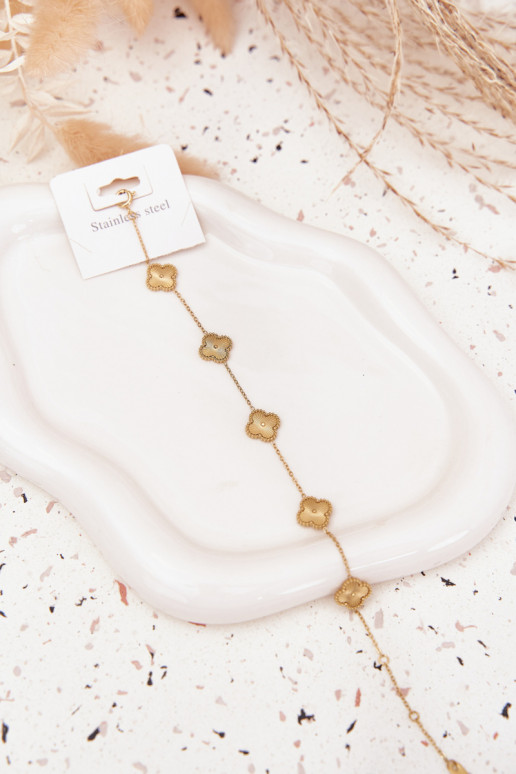 Una pulsera de acero inoxidablecon motivos floralesuszkami color dorado