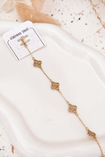 Una pulsera de acero inoxidable Con colgantes color dorado 2