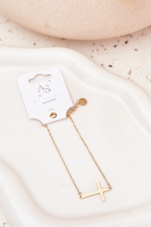 Una pulsera con una cruz Stal Chirurgiczna color dorado