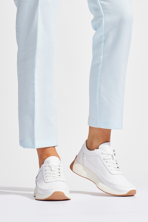 Femenino piel el color blanco zapatos deportivos