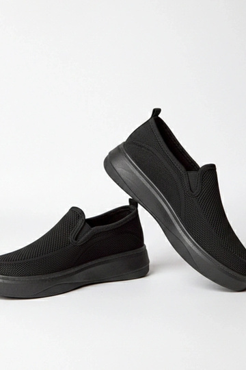 Zapatillas deportivas de tela negras con plataforma Céleste