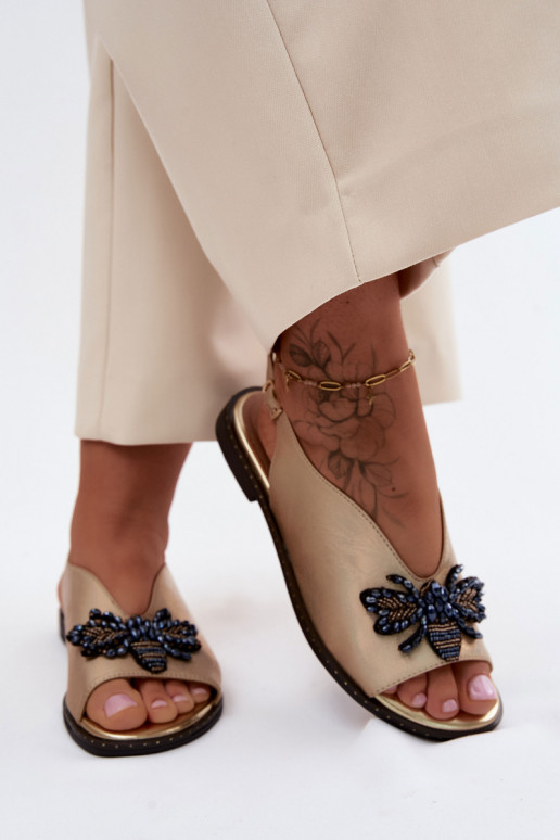 Sandalias brillantes con adornos en dorado plano Russona