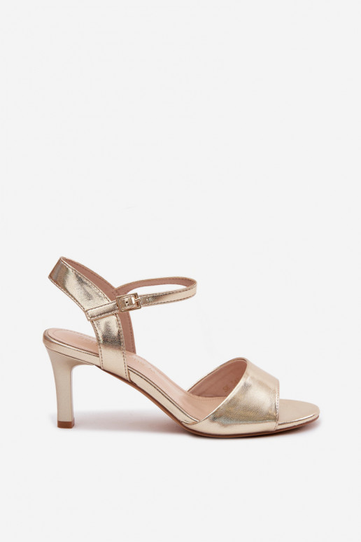 Sandalias de mujer en tacón fino de color oro de Sergio Leone