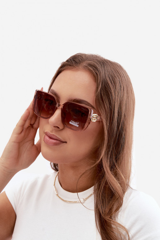 Gafas de sol con detalles decorativos en color rosa