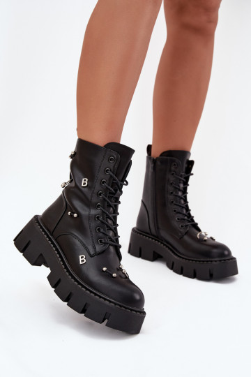 Botines de trabajo para mujer con bonitos detalles aislados en negro Lunea