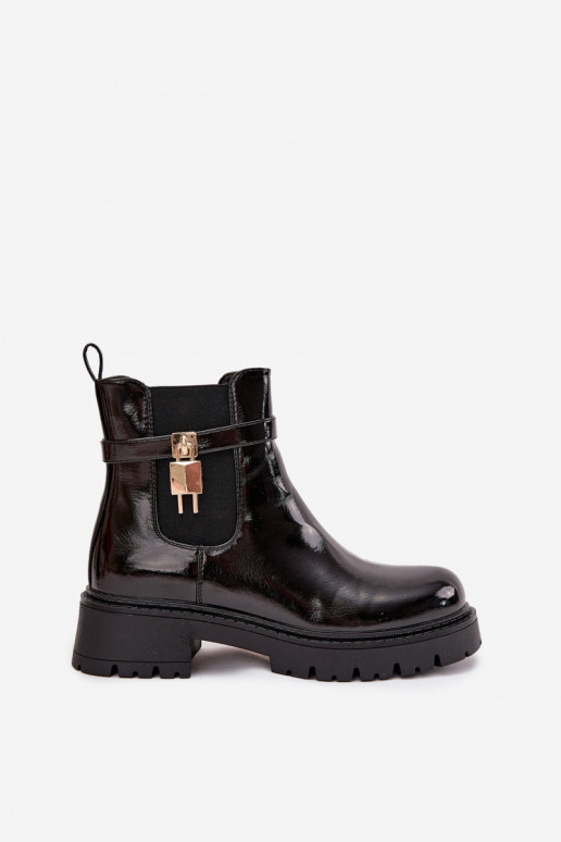 Botines aislados y elegantes con detalles Ze dorados y negros Talyra