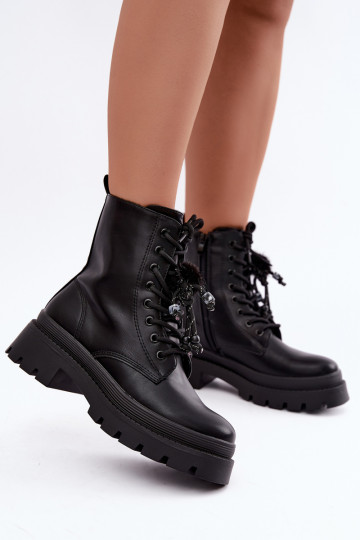 botas aisladas con pompones esponjosos en negro Faresse